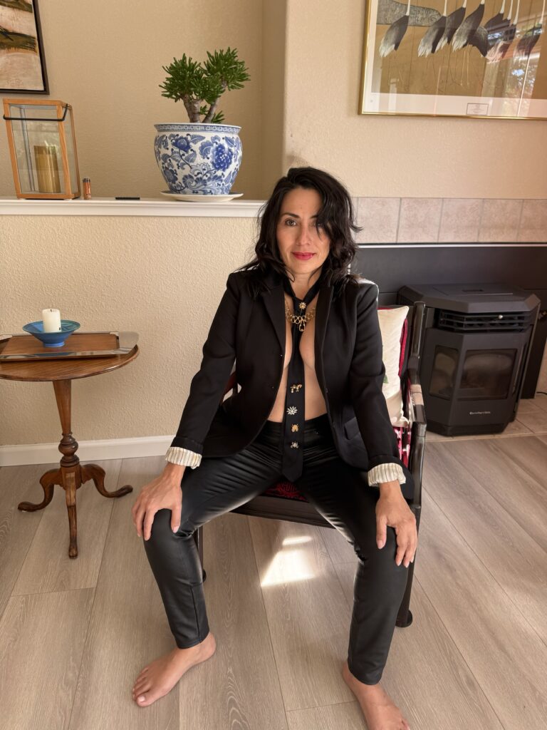 "Trinity, tantric dominatrix, seated in contemplation"